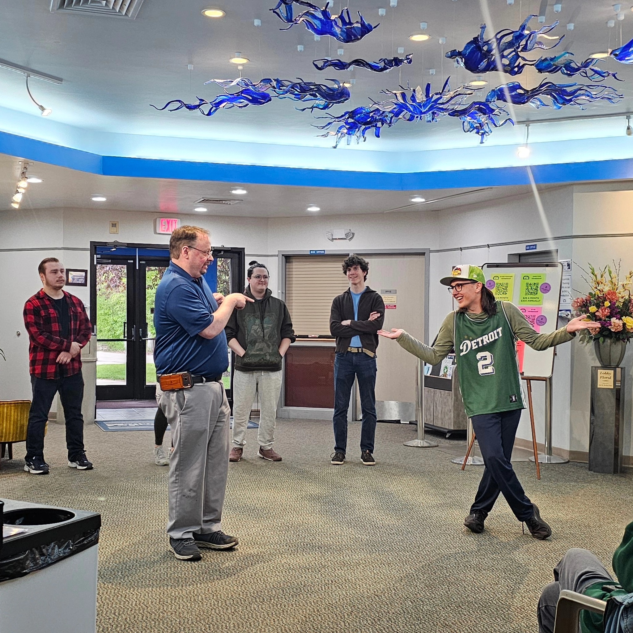Photo of improv rehearsal in the theatre lobby