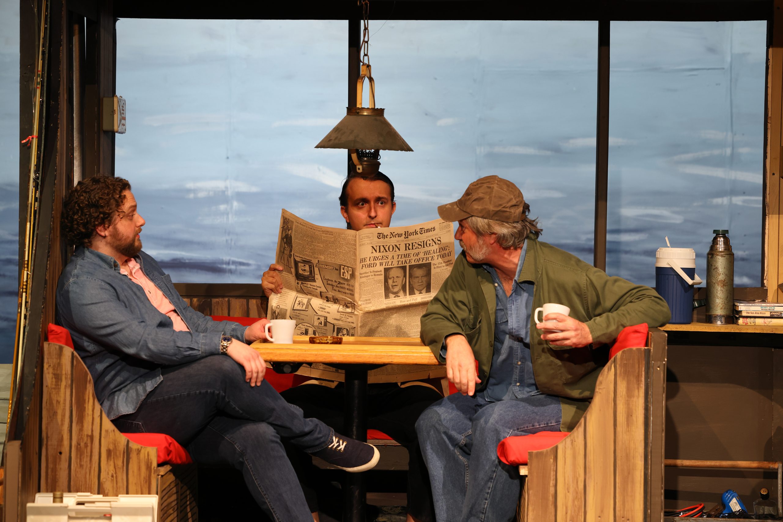 Dress rehearsal photo of three actors on the set of The Shark is Broken