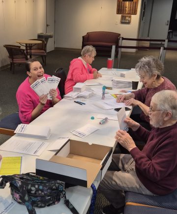 Letter writing volunteers prepare membership mailings